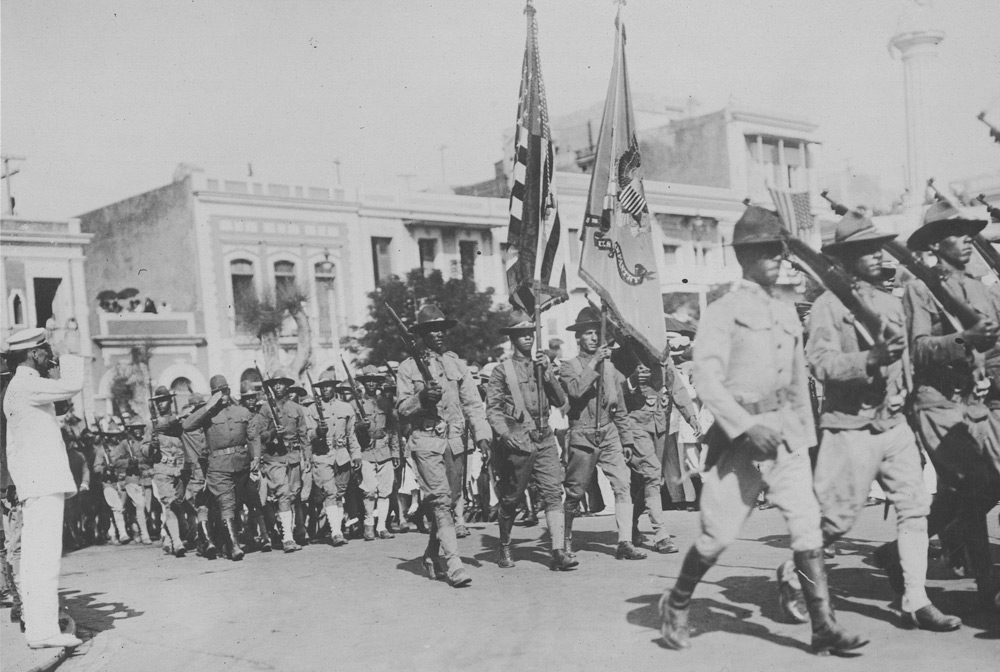 Puerto Rican soldiers of the 375th Regt. Inf. passing before the grand stand in the Liberty Day demonstration in Puerto Rico, October 1918 (National Archives)