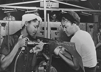 Luedell Mitchell and Lavada Cherry at work in the El Segundo Plant of the Douglas Aircraft Company during World War II. (National Archives) Luedell Mitchell and Lavada Cherry at work in the El Segundo Plant of the Dougla