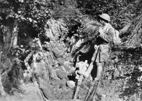 American soldiers rest in a trench in the Argonne Forest, France, 1918. From Collier's New Encyclopedia, vol. 10, 1921, between pp. 388 and 389 (5th plate). American soldiers rest in a trench in the Argonne Forest, France, 1918. From Col