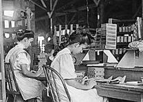 Girls working in a box factory in Tampa, Florida, photographed by Lewis Hine, ca. 1912. (National Archives and Records Administration) Girls working in a box factory, Tampa FL, by Lewis Hine, ca. 1912 (NARA 523166)