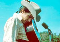 Corwin, Robert, photographer. Phil Ochs, Newport Folk Festival, 1966. Photograph. Newport, RI.: c 1966. Used with permission by Sonny Ochs. Corwin, Robert, photographer. Phil Ochs, Newport Folk Festival, 1966. Photograph