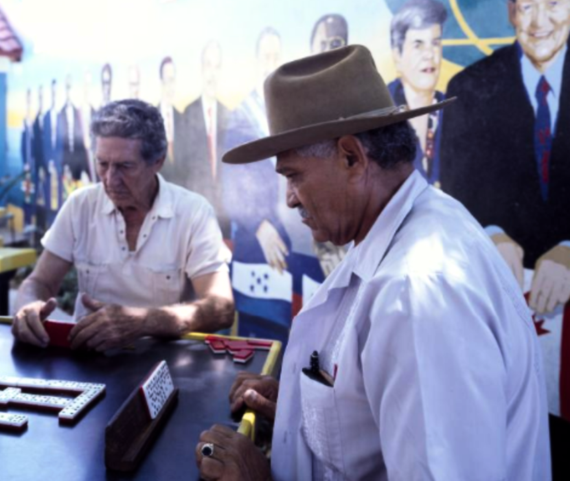 Photo of man playing Cuban dominos.