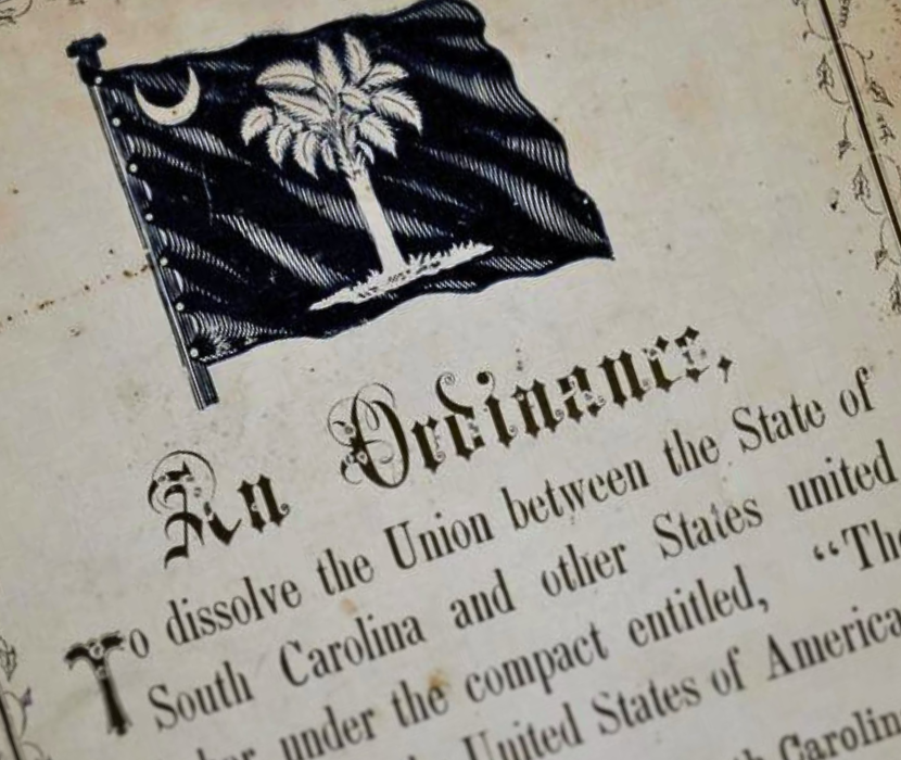 Detail from South Carolina's seccession ordinance with focus on South Carolina's flag and the ornate words "An Ordinance"