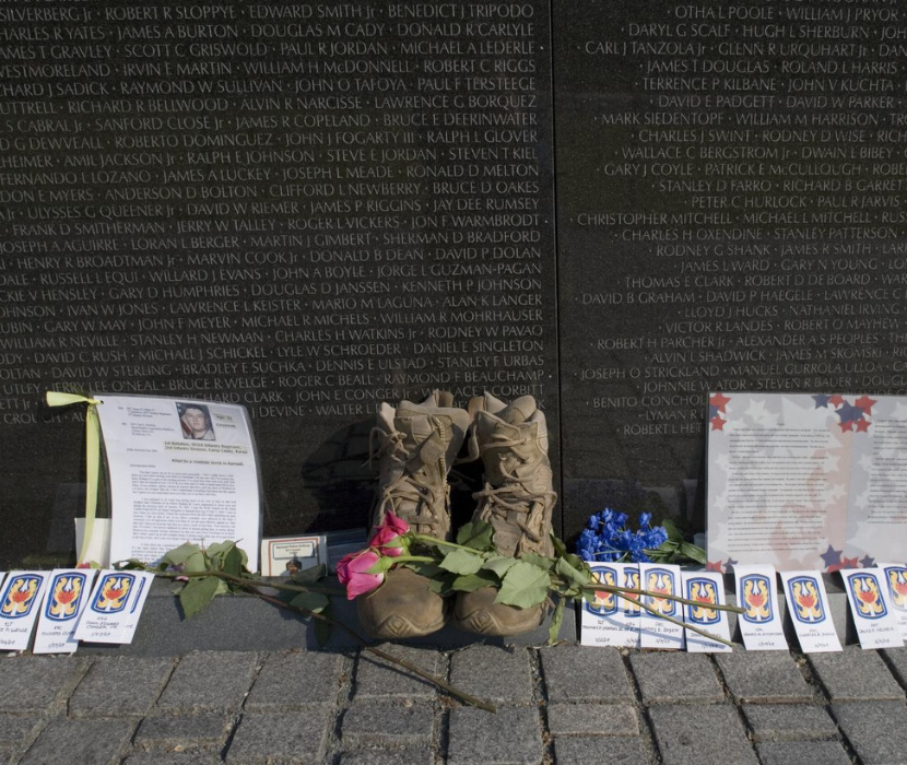 Photograph showing boots in front of the Vietham Memorial in Washington, D.C.