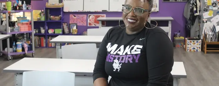 National History Teacher of the Year Valencia Abbott sitting in her classroom