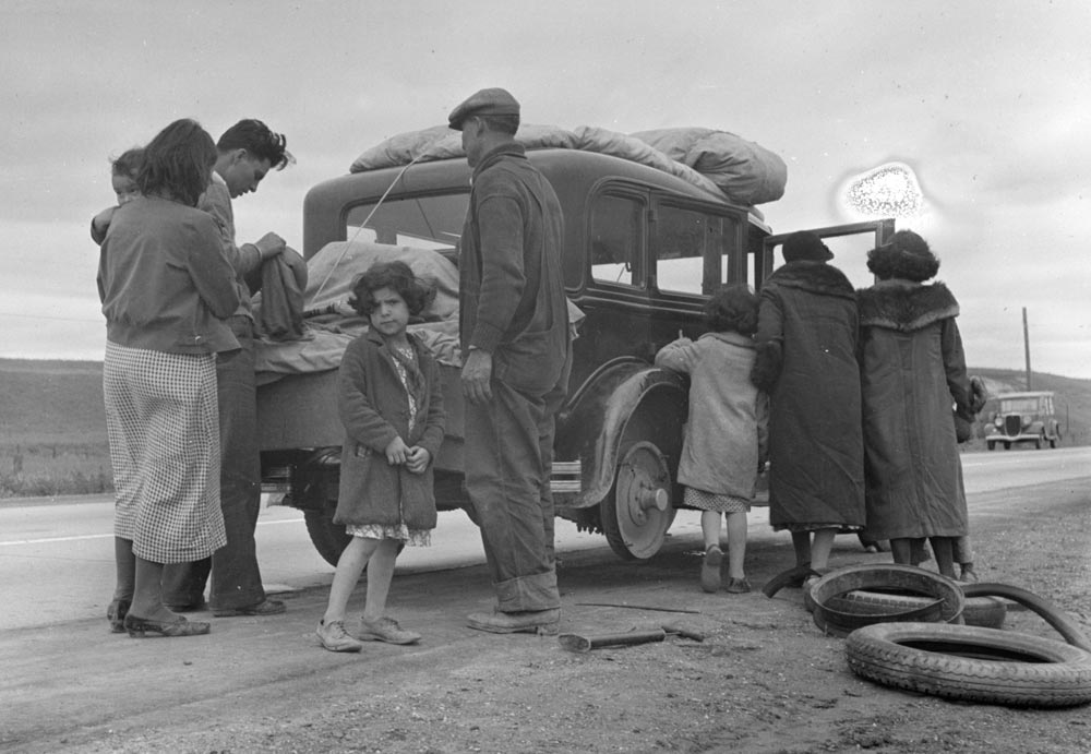 “Migrants, family of Mexicans, on road with tire trouble,” photograph by Dorothea Lange, February 1936 (Library of Congress)
