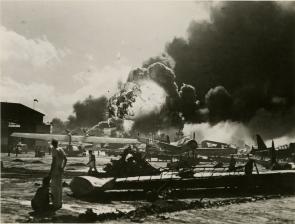 Servicemen observe the bombing of military airfields in Hawaii, December 7, 1941. (Gilder Lehrman Collection)