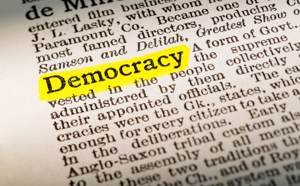 The word 'Democracy' highlighted in a dictionary