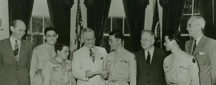 T/Sgt. Kuwayama presenting President Truman with a check contributed by members of the 442nd for a memorial to President Roosevelt [Sept. 11, 1945]