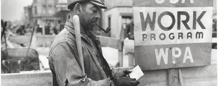 A Works Progress Administration worker receiving his paycheck.