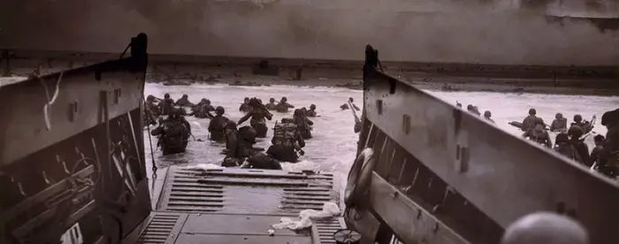 American soldiers wading in water during D-Day invasion