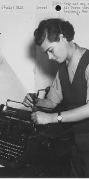 Black and white photograph a female typewriter mechanic in the Air Force repairing a typewriter.