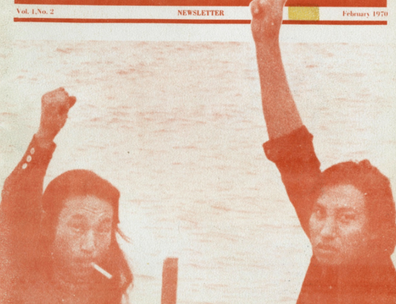 Photograph of two Native Americans with their arms raised