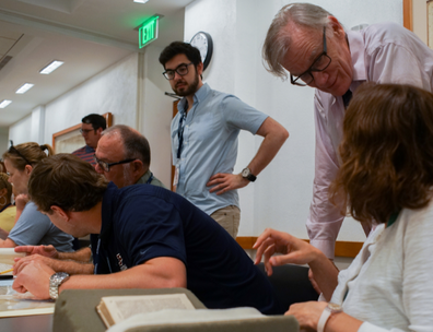 View of Professor David Blight talking with teachers at the Collection