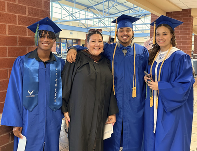 Wunneanatsu Lamb-Cason with graduating students