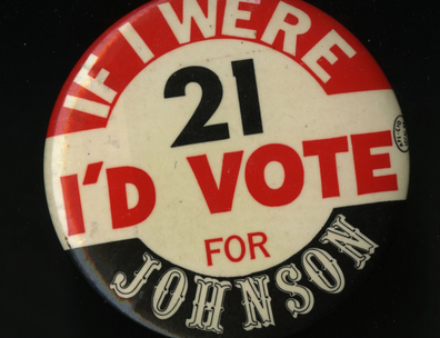 A campaign button reading "If I were 21 I'd vote for Johnson"